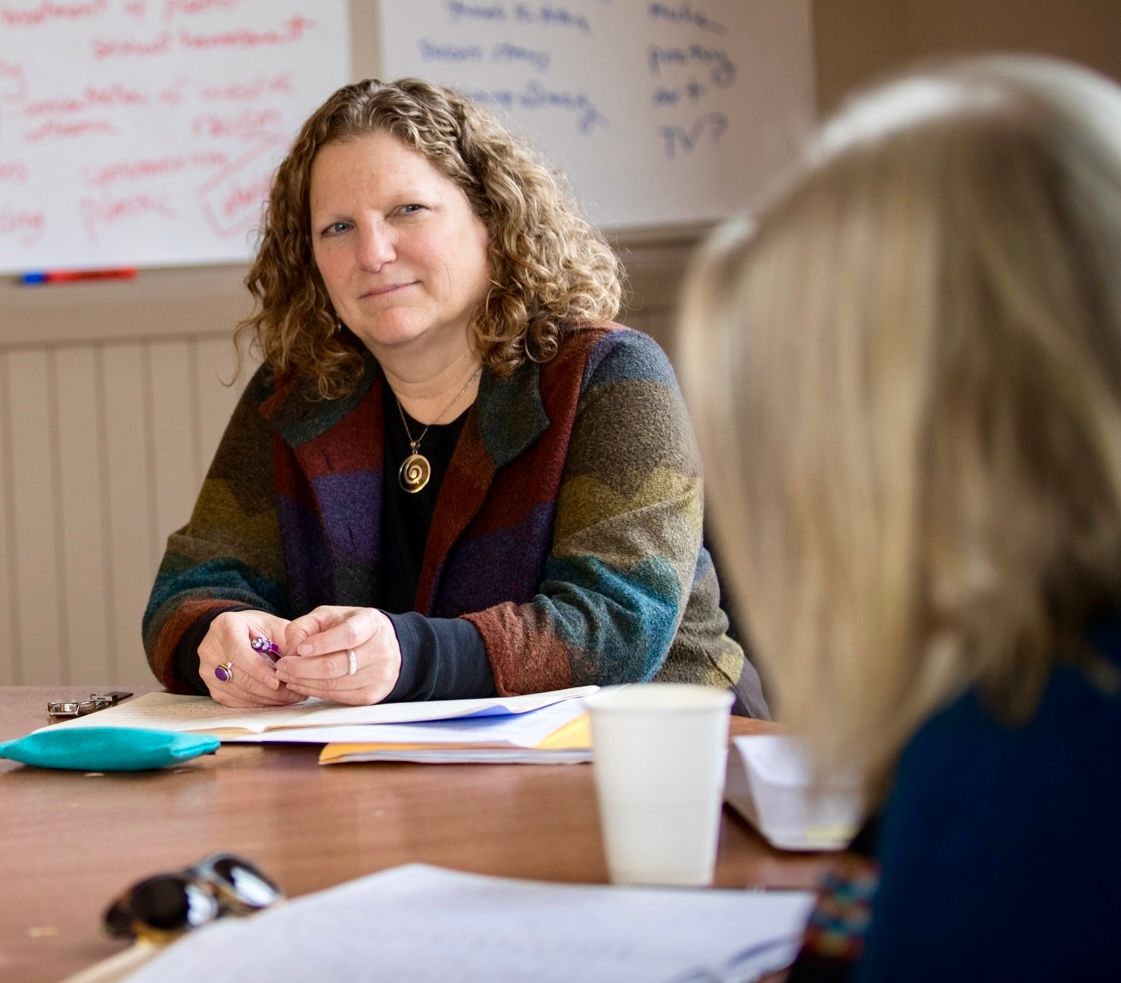Jennifer coaching writers in a workshop setting